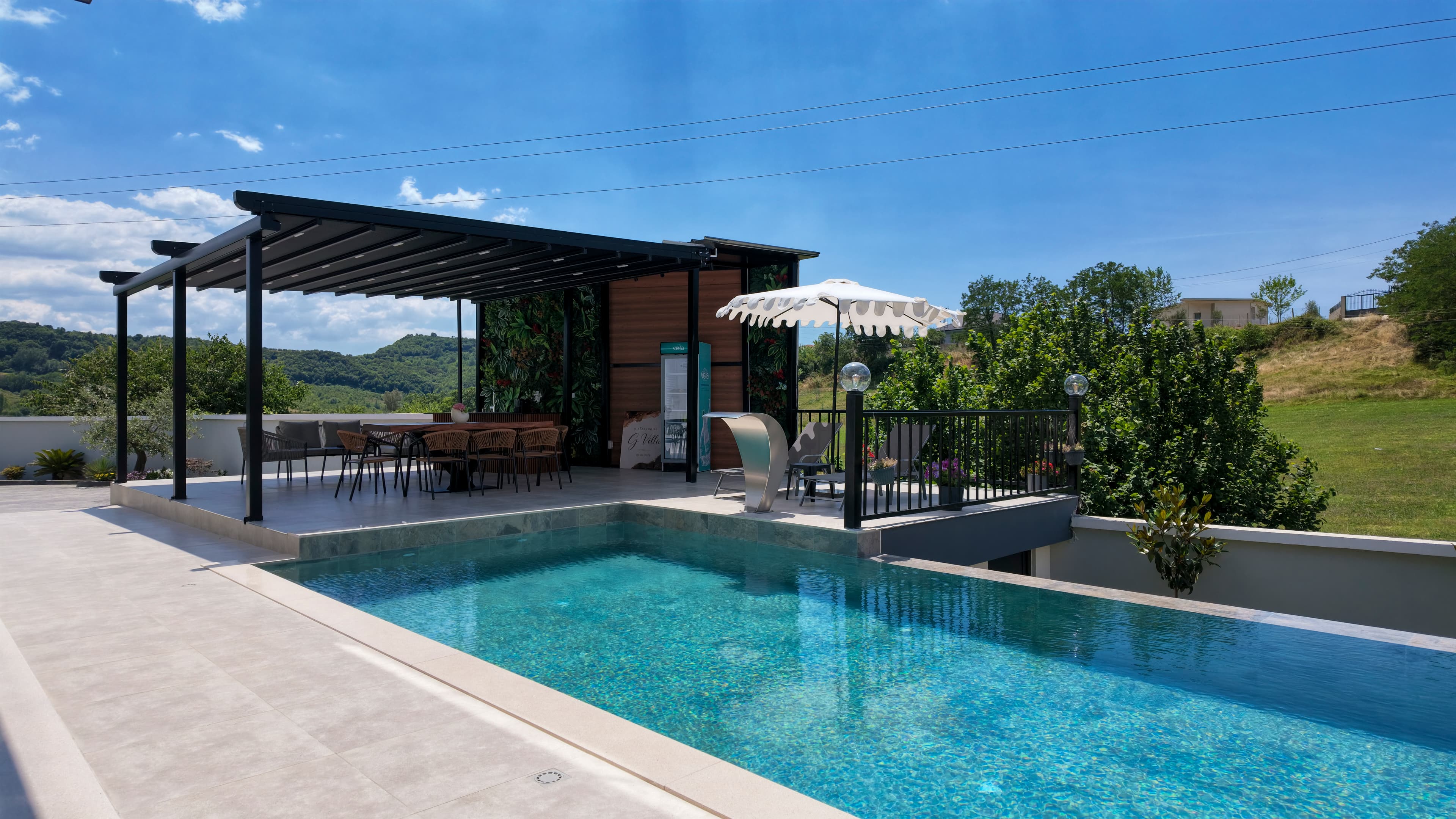 The pool and pergola, with the valley beyond