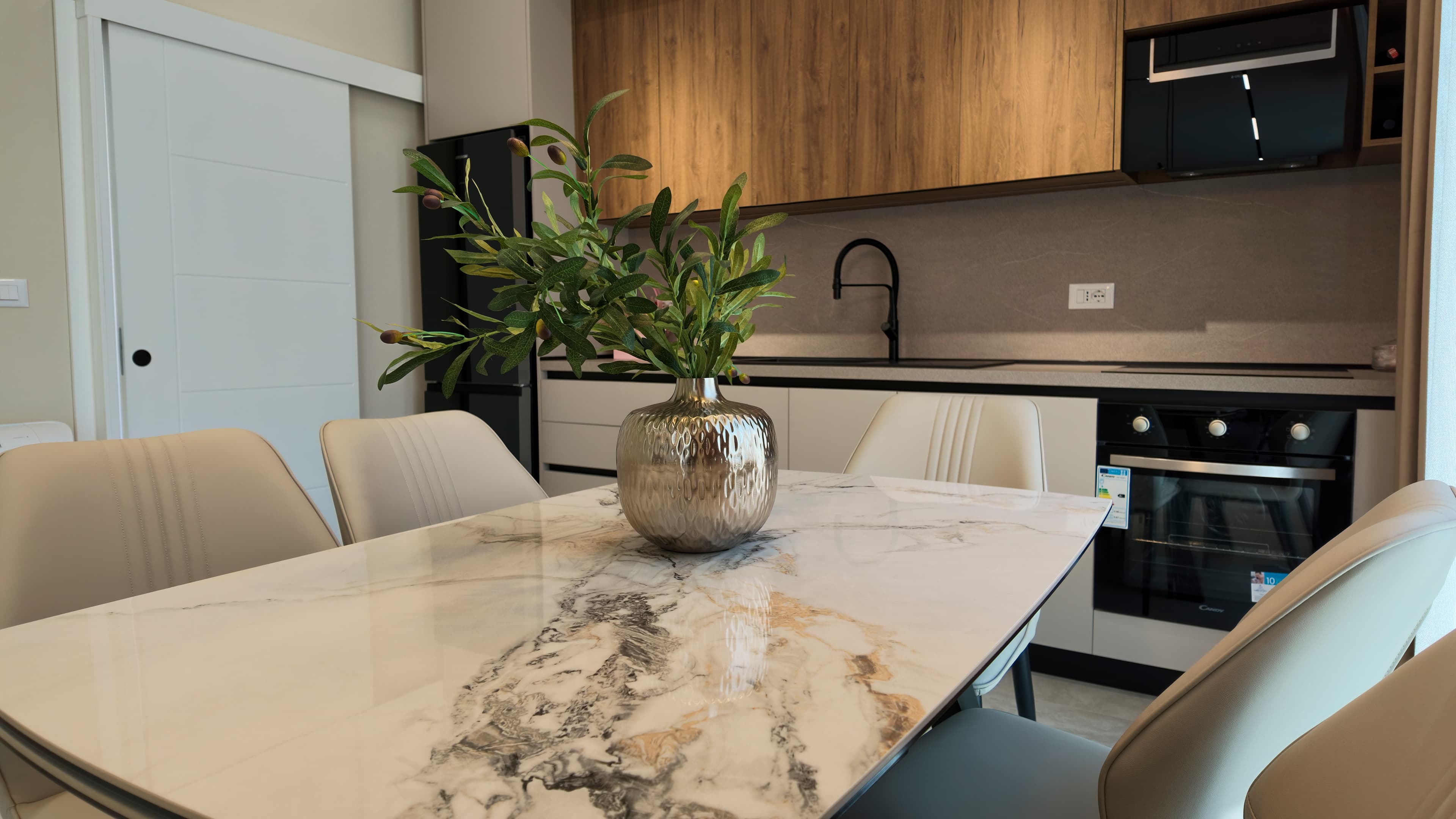 The kitchen and marble dining table
